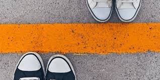 yellow line in the middles with only a pair of shoes showing on each side